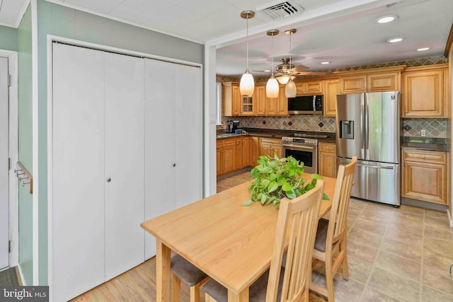 803 Libby Ln, Langhorne, PA 19053 - kitchen featuring appliances with stainless steel finishes, decorative backsplash, dark countertops, ceiling fan, and recessed lighting