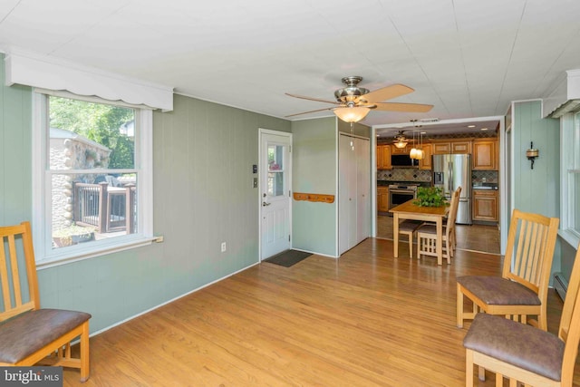803 Libby Ln, Langhorne, PA 19053 - kitchen with stainless steel appliances, light wood finished floors, a ceiling fan, and brown cabinets