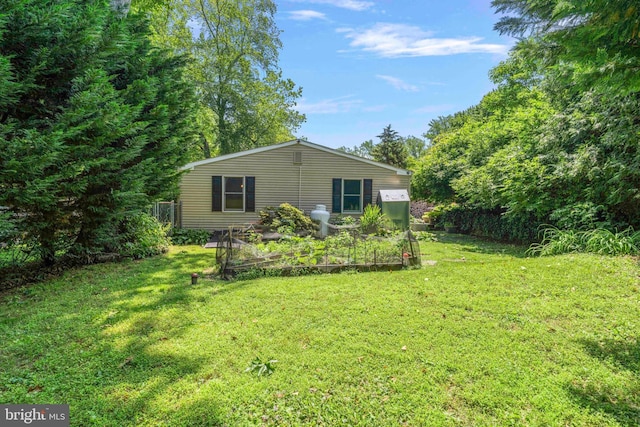 803 Libby Ln, Langhorne, PA 19053 - view of property exterior featuring a garden and a lawn