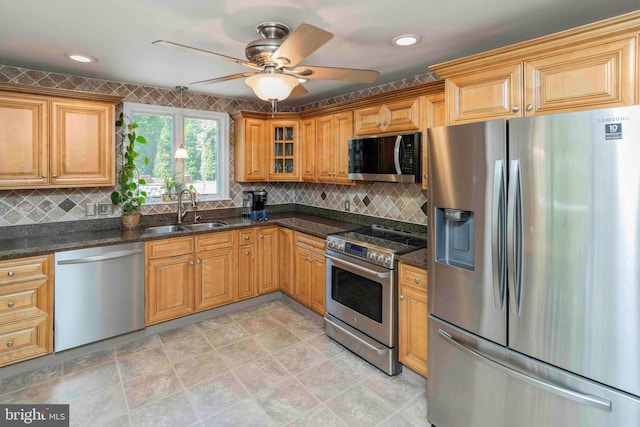 803 Libby Ln, Langhorne, PA 19053 - kitchen with appliances with stainless steel finishes, tasteful backsplash, a ceiling fan, dark stone counters, and glass insert cabinets