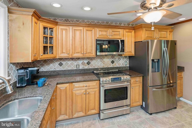 803 Libby Ln, Langhorne, PA 19053 - kitchen featuring appliances with stainless steel finishes, ceiling fan, backsplash, glass insert cabinets, and dark stone countertops