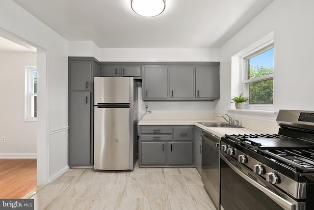 10409 Royalton Ter, Silver Spring, MD 20901 - kitchen featuring stainless steel appliances, gray cabinets, and light countertops