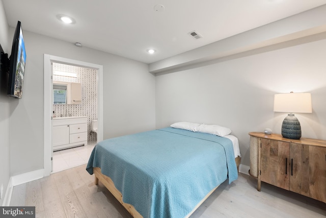 1638 K St NE Unit 101, Washington, DC 20002 - bedroom featuring light wood-style flooring, ensuite bath, and recessed lighting