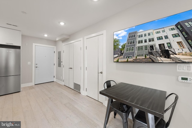 1638 K St NE Unit 101, Washington, DC 20002 - dining area with electric panel, wood finished floors, and recessed lighting