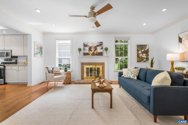 1433 River Oaks Rdg, Charlottesville, VA 22901 - living area featuring light wood-style floors, ceiling fan, ornamental molding, recessed lighting, and a brick fireplace