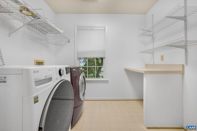 1433 River Oaks Rdg, Charlottesville, VA 22901 - washroom featuring washing machine and clothes dryer and tile patterned floors