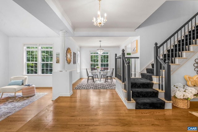 1433 River Oaks Rdg, Charlottesville, VA 22901 - entrance foyer featuring a chandelier, stairway, wood finished floors, and crown molding