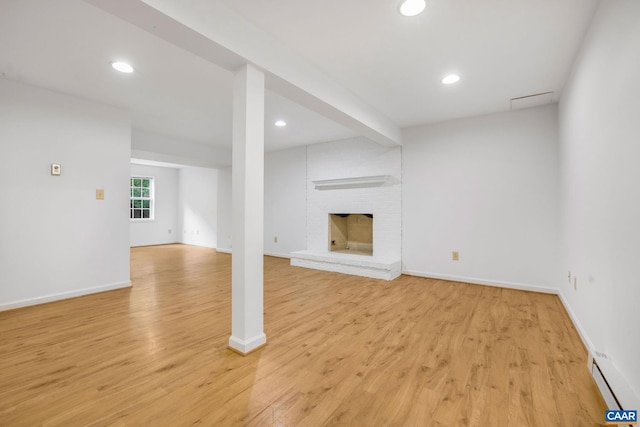 1433 River Oaks Rdg, Charlottesville, VA 22901 - unfurnished living room with a baseboard radiator, light wood-style flooring, recessed lighting, and a fireplace