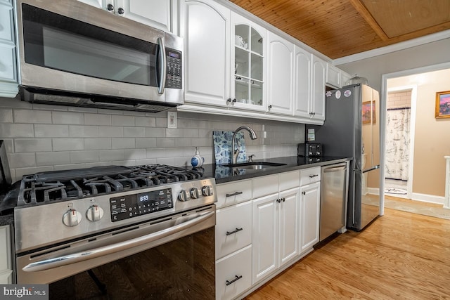 24 Paul Rd, Maple Shade, NJ 08052 - kitchen with stainless steel appliances, wooden ceiling, white cabinetry, light wood finished floors, and glass insert cabinets