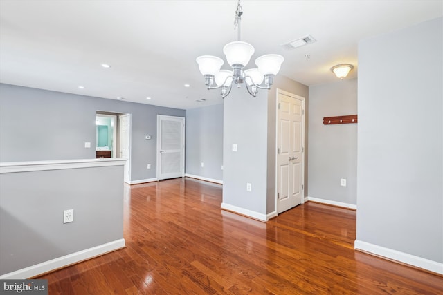 4163 S Four Mile Run Dr Unit 401, Arlington, VA 22204 - empty room featuring a chandelier, wood finished floors, and recessed lighting