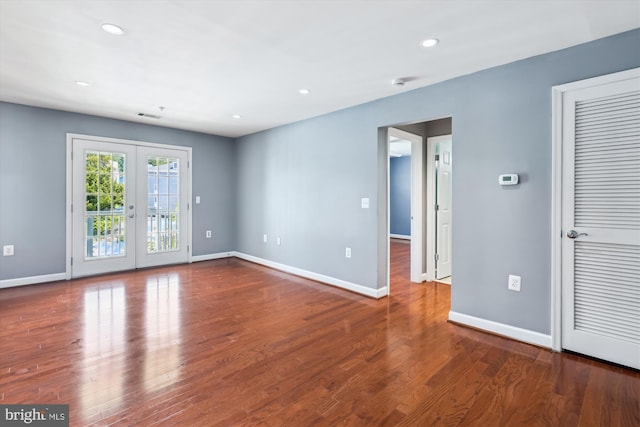 4163 S Four Mile Run Dr Unit 401, Arlington, VA 22204 - empty room featuring wood finished floors, recessed lighting, french doors, and a smoke detector