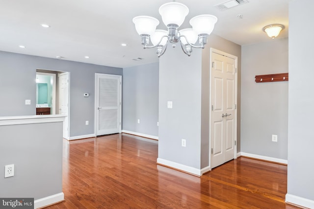 4163 S Four Mile Run Dr Unit 401, Arlington, VA 22204 - unfurnished room with wood finished floors, a chandelier, and recessed lighting