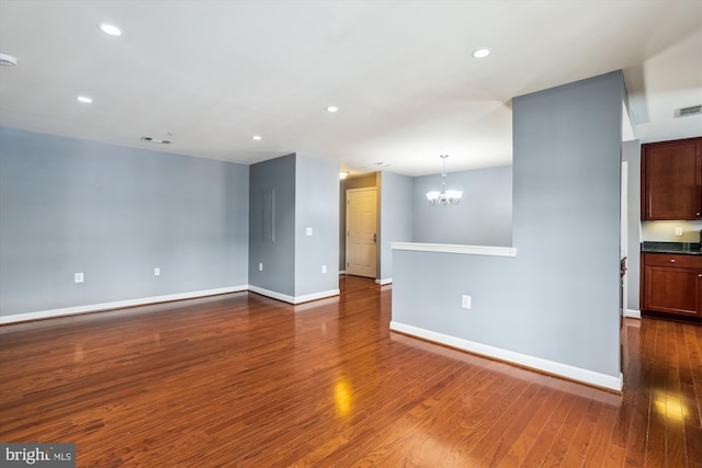 4163 S Four Mile Run Dr Unit 401, Arlington, VA 22204 - empty room with a chandelier, dark wood-style floors, recessed lighting, and a smoke detector