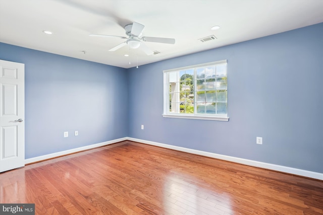 4163 S Four Mile Run Dr Unit 401, Arlington, VA 22204 - spare room with wood finished floors, ceiling fan, and recessed lighting