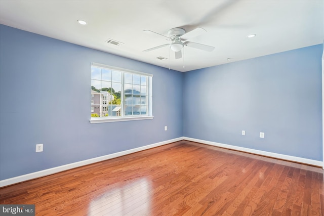 4163 S Four Mile Run Dr Unit 401, Arlington, VA 22204 - spare room with a ceiling fan, wood finished floors, and recessed lighting