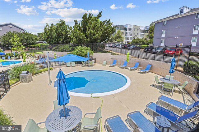 4163 S Four Mile Run Dr Unit 401, Arlington, VA 22204 - community pool featuring a patio