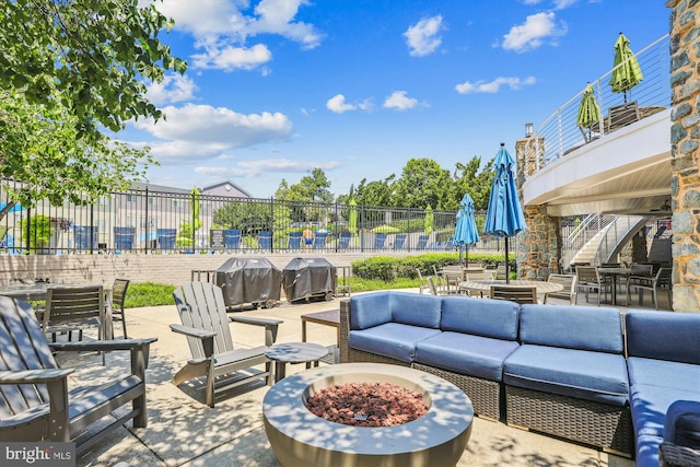 4163 S Four Mile Run Dr Unit 401, Arlington, VA 22204 - view of patio with an outdoor living space with a fire pit, a grill, and outdoor dining area