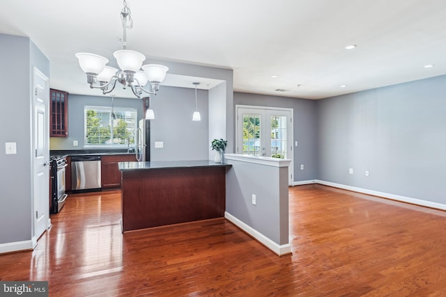 4163 S Four Mile Run Dr Unit 401, Arlington, VA 22204 - kitchen with stainless steel appliances, a chandelier, healthy amount of natural light, dark countertops, and recessed lighting