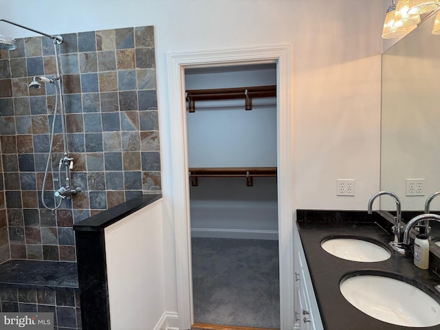 7071 Pomona Rd, Chestertown, MD 21620 - full bath with double vanity, tiled shower, and a walk in closet