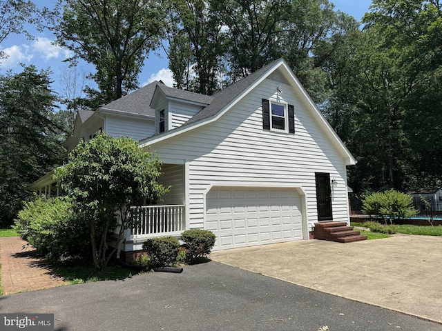 7071 Pomona Rd, Chestertown, MD 21620 - view of home's exterior featuring driveway, roof with shingles, and covered porch