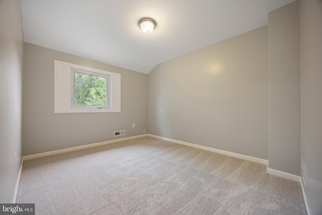 4703 Williston St, Baltimore, MD 21229 - unfurnished room with light colored carpet and vaulted ceiling