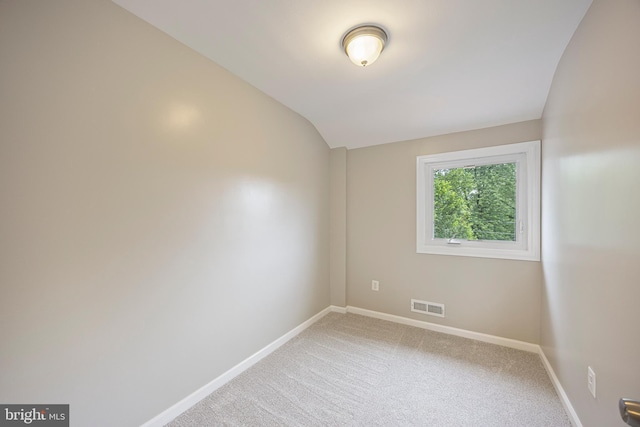 4703 Williston St, Baltimore, MD 21229 - empty room with vaulted ceiling and light carpet
