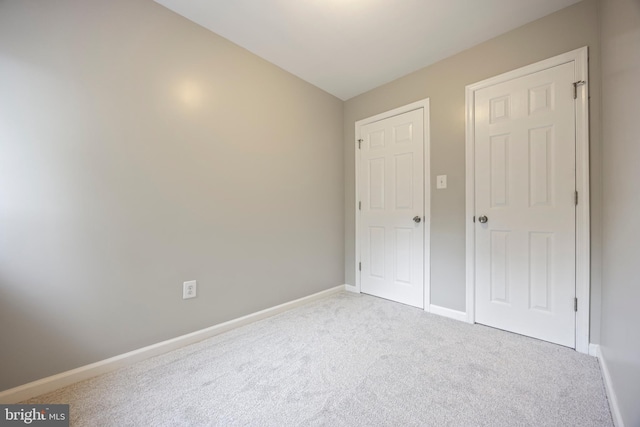 4703 Williston St, Baltimore, MD 21229 - unfurnished bedroom featuring carpet floors and baseboards