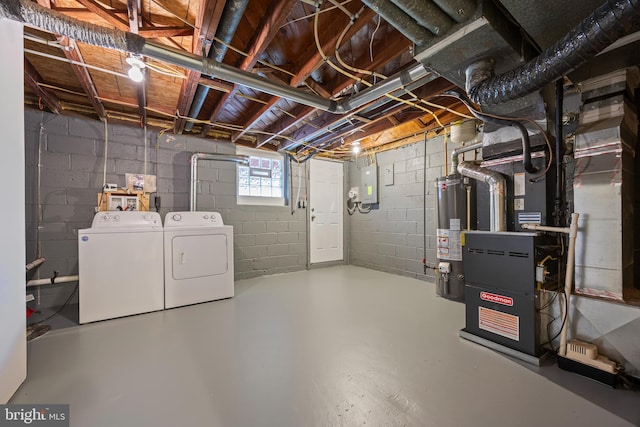 4703 Williston St, Baltimore, MD 21229 - below grade area featuring washer and clothes dryer, water heater, and heating unit