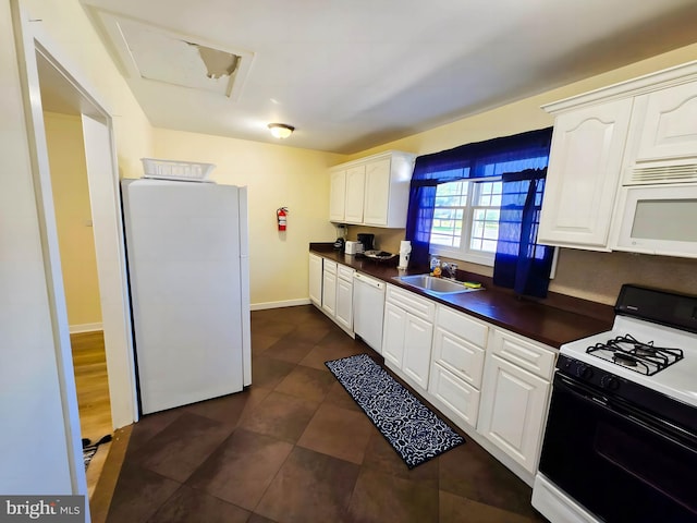 102 Red Lion Rd, Southampton, NJ 08088 - kitchen featuring white appliances, dark countertops, white cabinetry, and dark tile patterned flooring