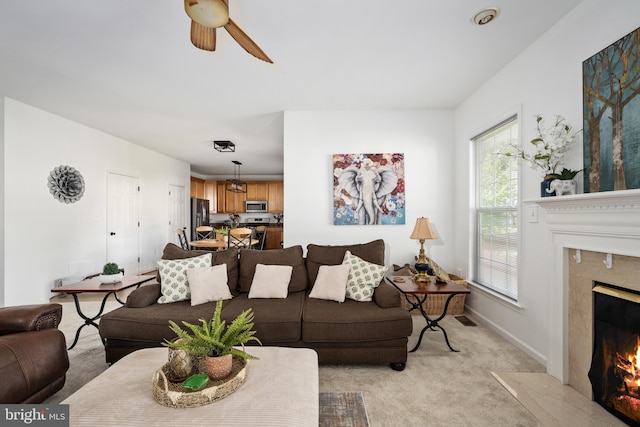 17 Saint Claires Ct, Stafford, VA 22556 - living area featuring light carpet, a fireplace, and a ceiling fan