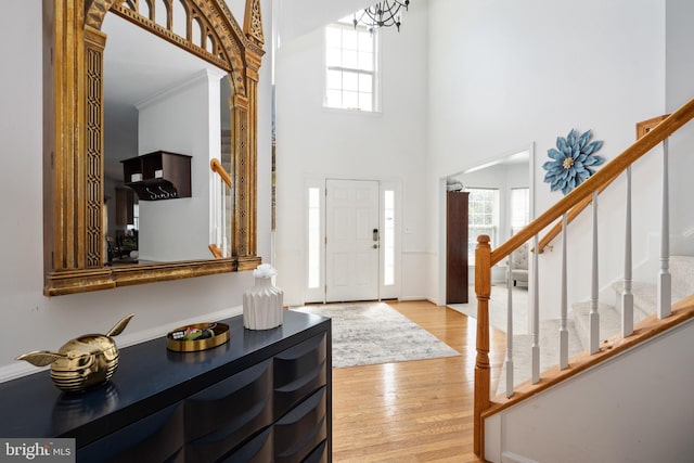 17 Saint Claires Ct, Stafford, VA 22556 - entryway featuring stairs, a towering ceiling, plenty of natural light, and light wood finished floors