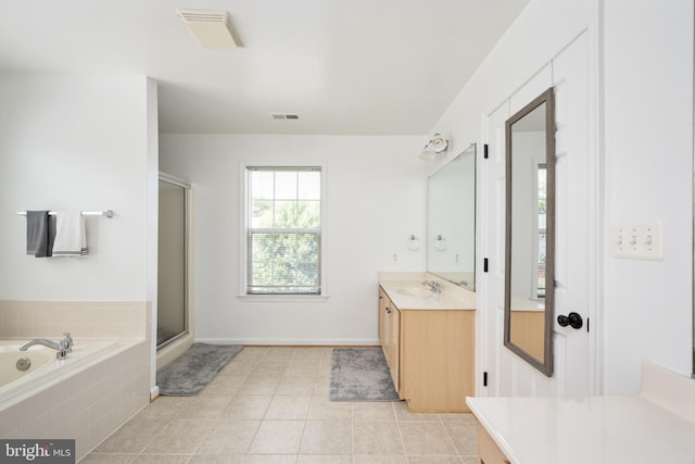 17 Saint Claires Ct, Stafford, VA 22556 - bathroom featuring vanity, a bath, a shower with door, and tile patterned floors