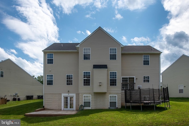 17 Saint Claires Ct, Stafford, VA 22556 - back of house featuring a lawn, french doors, a trampoline, and a patio area