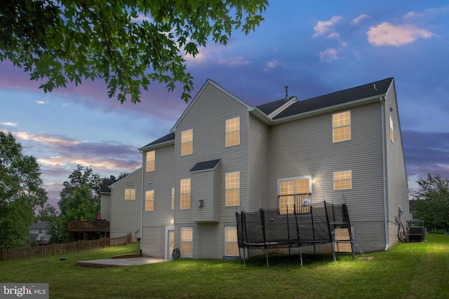 17 Saint Claires Ct, Stafford, VA 22556 - back of property at dusk featuring a trampoline and a patio