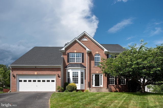 17 Saint Claires Ct, Stafford, VA 22556 - view of front of home with brick siding, driveway, and a front lawn