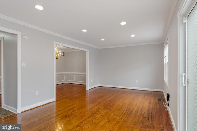 9518 Unity Ln, Lorton, VA 22079 - spare room with wood finished floors, crown molding, a chandelier, and recessed lighting