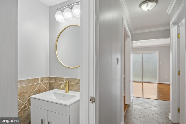 9518 Unity Ln, Lorton, VA 22079 - bathroom featuring vanity, ornamental molding, tile patterned floors, tile walls, and wainscoting