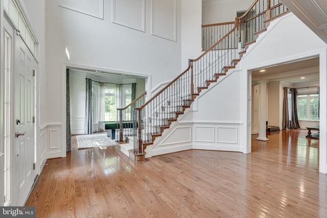 10002 Courthouse Rd, Vienna, VA 22181 - entrance foyer with a decorative wall, plenty of natural light, stairs, wood finished floors, and a high ceiling
