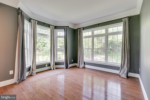 10002 Courthouse Rd, Vienna, VA 22181 - spare room with ornamental molding, healthy amount of natural light, and wood finished floors