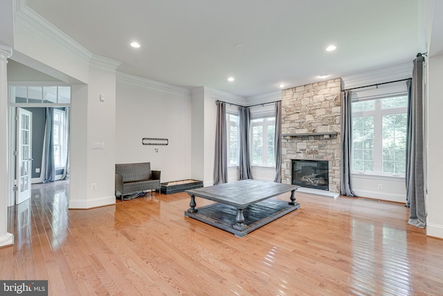 10002 Courthouse Rd, Vienna, VA 22181 - living room featuring healthy amount of natural light, ornamental molding, wood finished floors, a stone fireplace, and recessed lighting