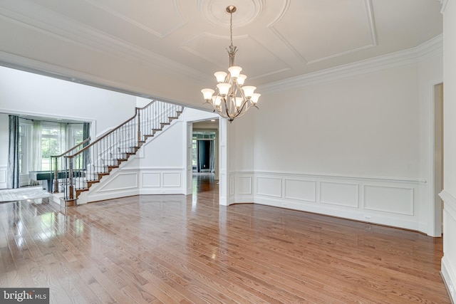 10002 Courthouse Rd, Vienna, VA 22181 - empty room with stairway, light wood-style floors, a decorative wall, a chandelier, and crown molding
