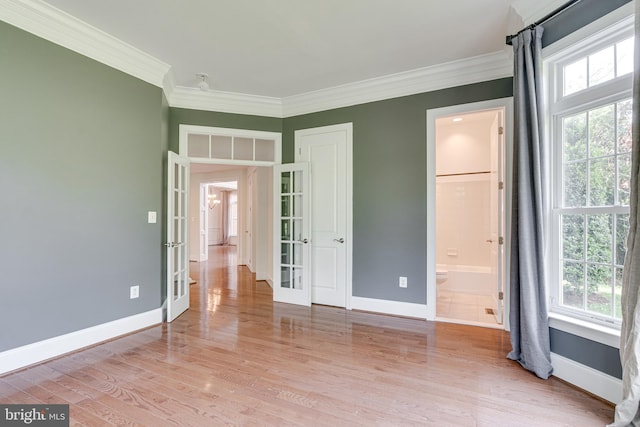 10002 Courthouse Rd, Vienna, VA 22181 - unfurnished bedroom featuring french doors, multiple windows, crown molding, light wood finished floors, and ensuite bath