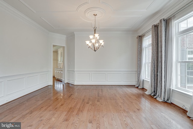 10002 Courthouse Rd, Vienna, VA 22181 - unfurnished room with a chandelier, light wood-type flooring, wainscoting, crown molding, and a decorative wall