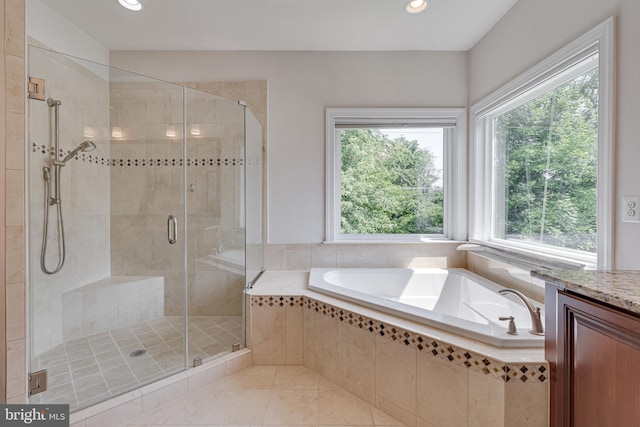10002 Courthouse Rd, Vienna, VA 22181 - bathroom featuring a bath, healthy amount of natural light, a shower stall, and recessed lighting