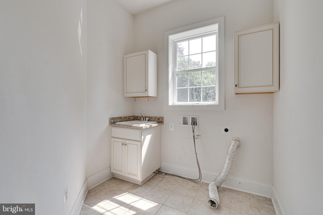 10002 Courthouse Rd, Vienna, VA 22181 - washroom featuring hookup for an electric dryer, cabinet space, washer hookup, and light tile patterned floors