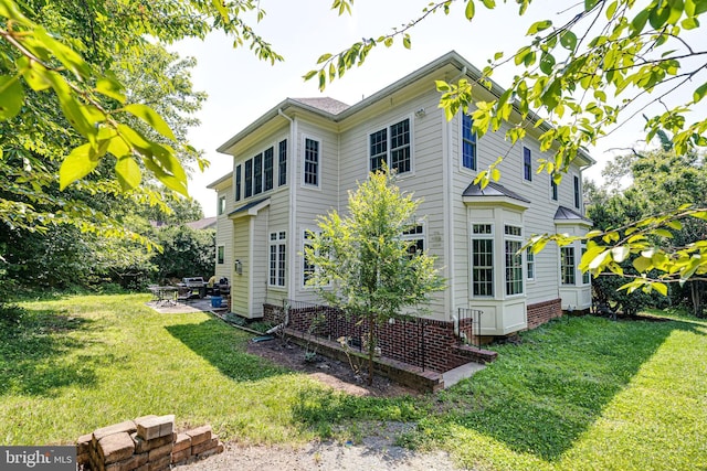 10002 Courthouse Rd, Vienna, VA 22181 - rear view of property featuring a yard and a patio