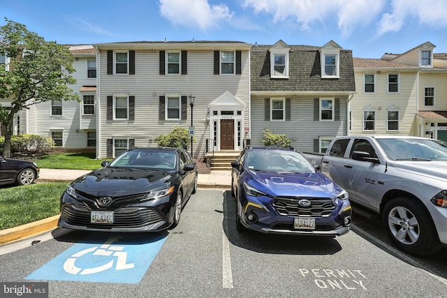 20315 Beaconfield Ter Unit 202, Germantown, MD 20874 - townhome / multi-family property with roof with shingles, uncovered parking, and mansard roof
