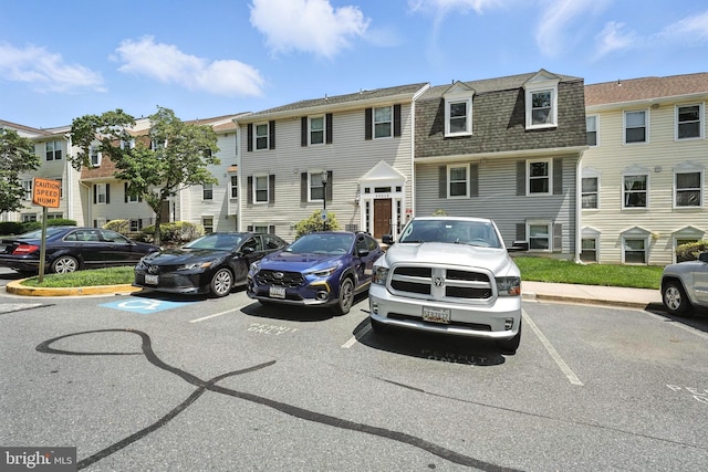 20315 Beaconfield Ter Unit 202, Germantown, MD 20874 - townhome / multi-family property featuring uncovered parking, roof with shingles, and a residential view