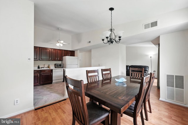 20315 Beaconfield Ter Unit 202, Germantown, MD 20874 - dining room featuring light wood-type flooring, a chandelier, high vaulted ceiling, and ceiling fan