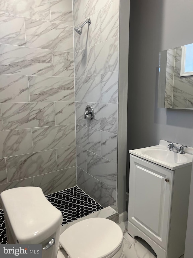2036 W Ontario St, Philadelphia, PA 19140 - bathroom with a stall shower, vanity, and marble look tile flooring